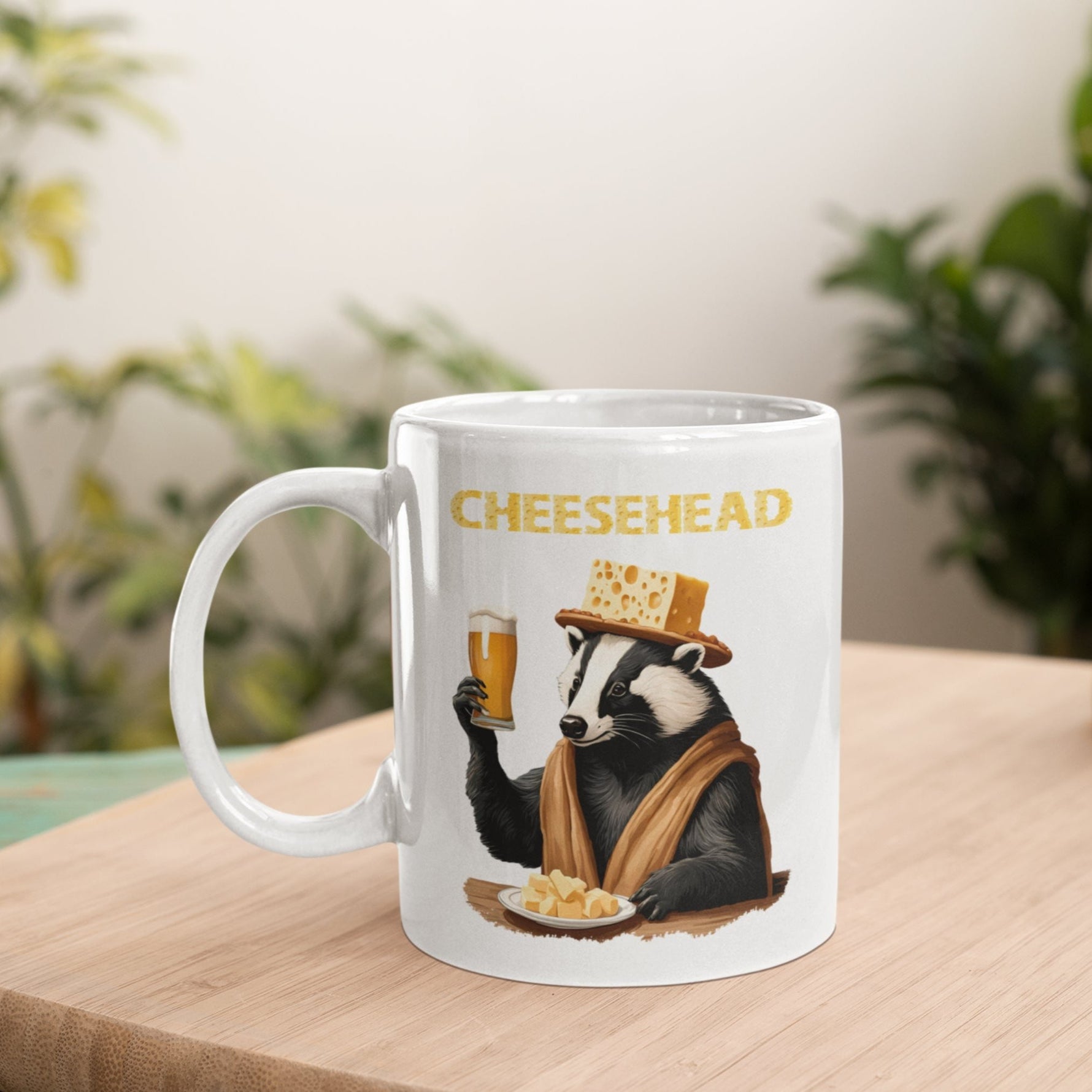 a coffee mug with a picture of a badger holding a glass of beer sitting on a wood table with plants in background
