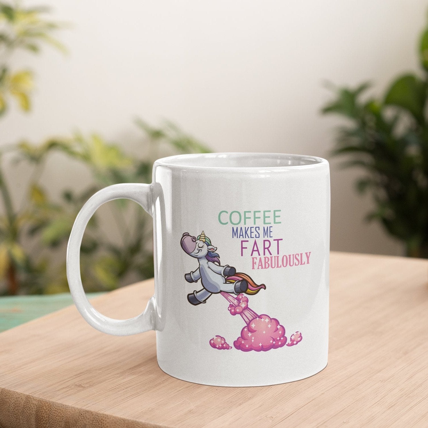 a white coffee mug sitting on top of a wooden table
