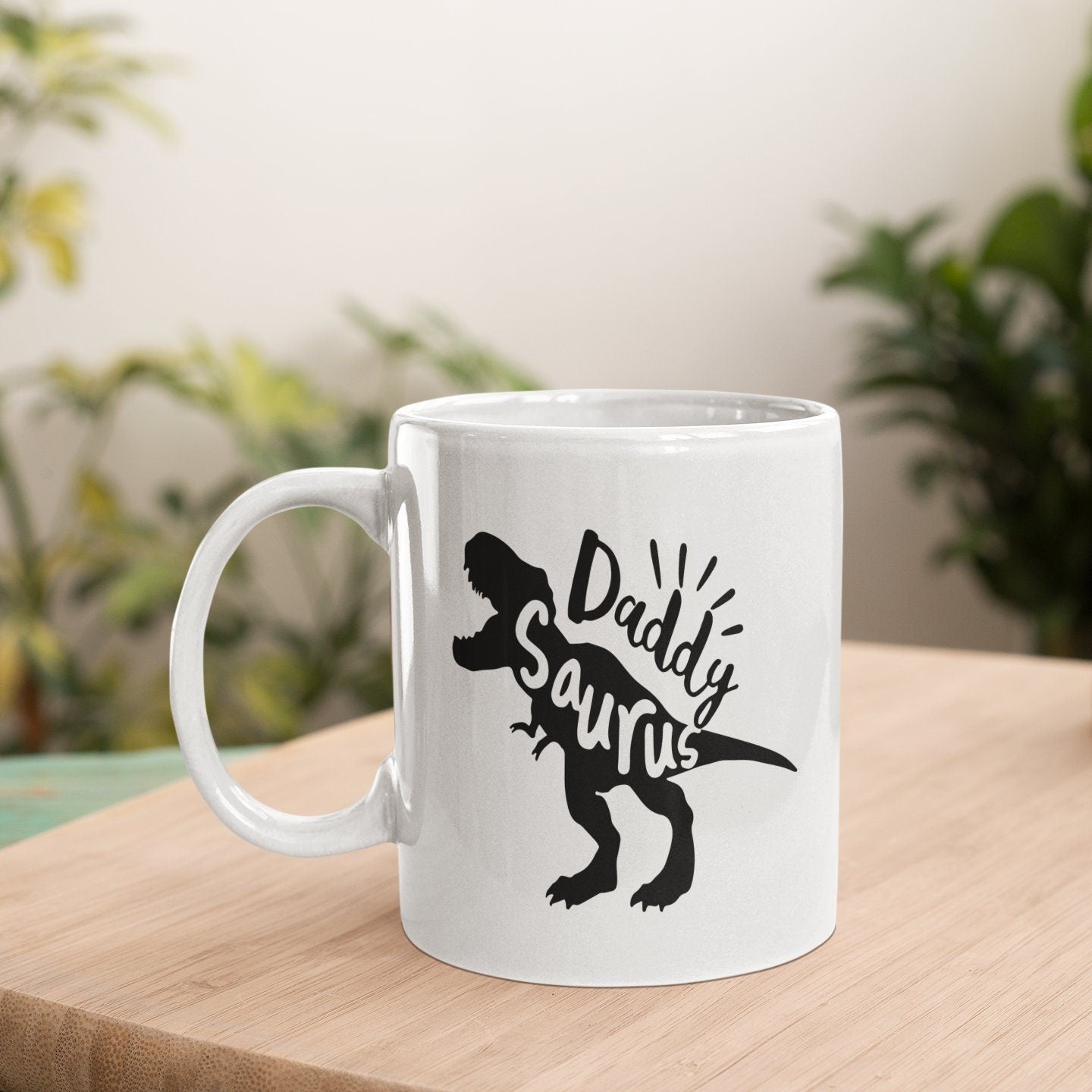 a white coffee mug sitting on top of a wooden table