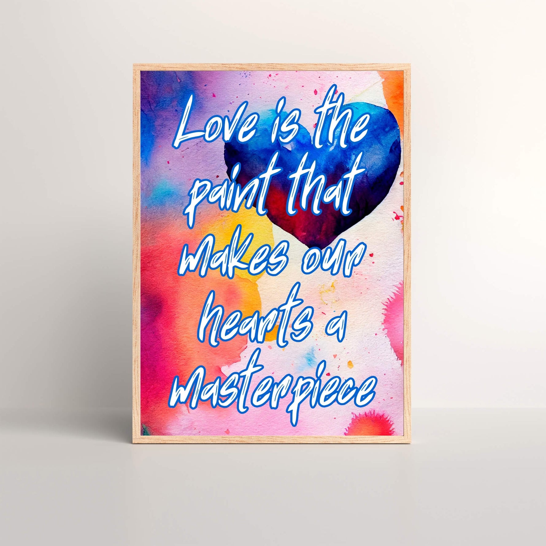 Framed art prints that displays the a color quote that says 'Love is the paint that makes our hearts a masterpiece'