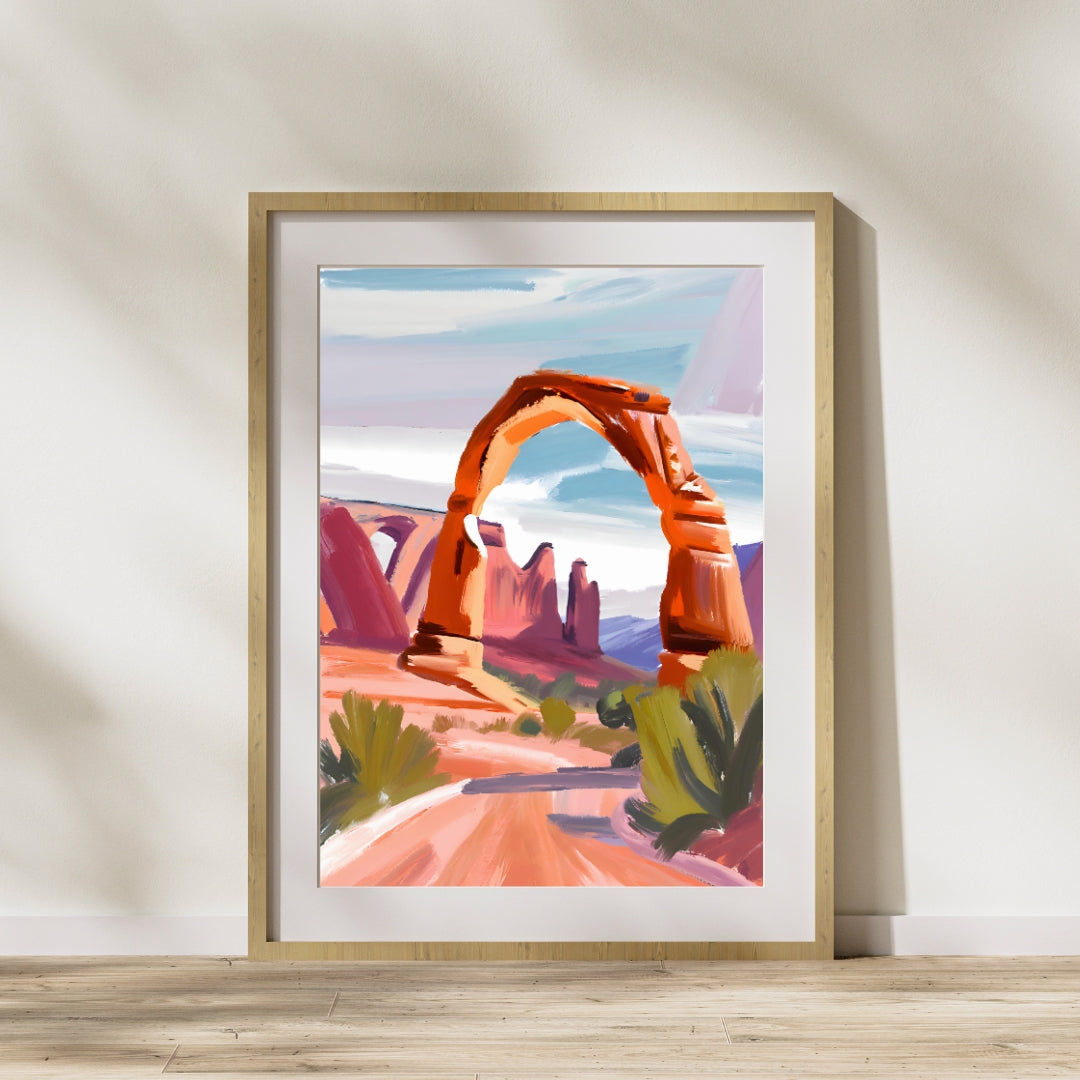 Delicate Arch at Arches National Park Art Print in an oak frame sitting on floor leaning up against a white wall