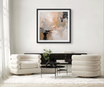 a living room with white furniture and a painting on the wall