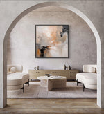 a living room with a large painting on the wall