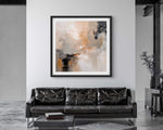 a living room with a couch and an abstract contemporary art print on the wall