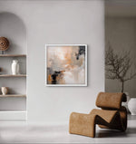 a painting hanging on a wall next to a chair
