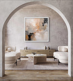 a living room filled with furniture and a painting on the wall