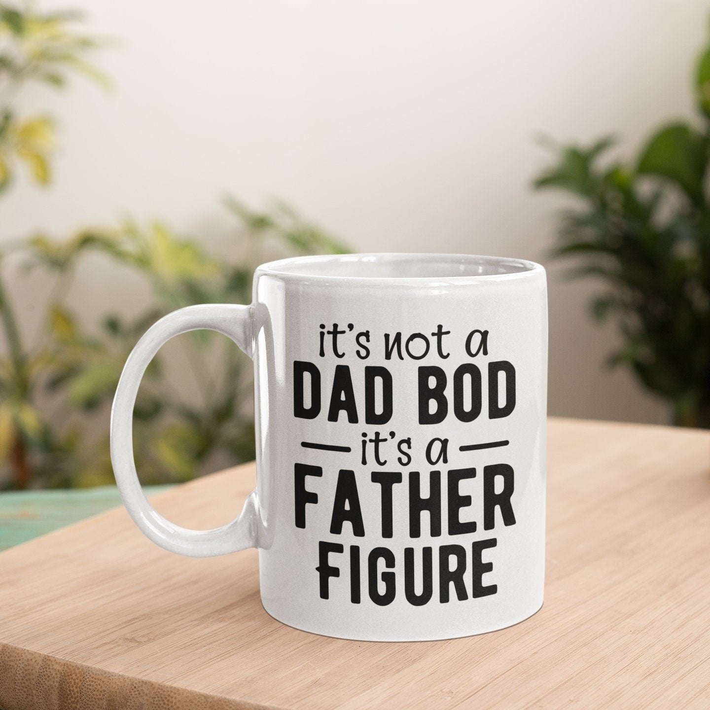 a white coffee mug that says it's not a dad bod it '