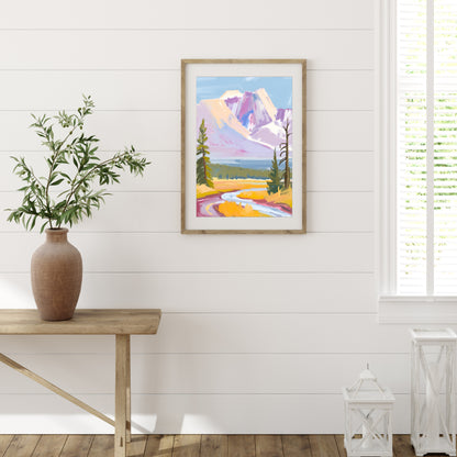 a painting hanging on a wall next to a wooden table