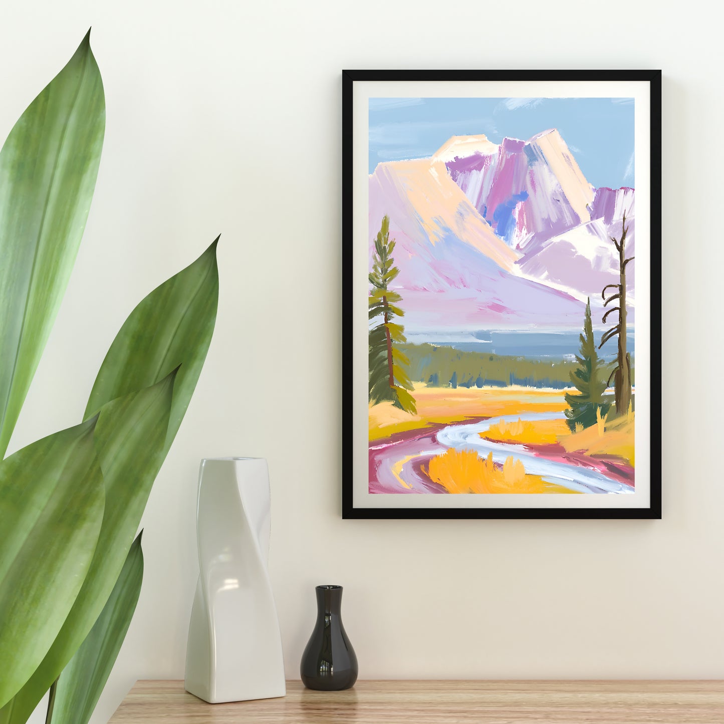 a painting of a mountain landscape hangs on a wall